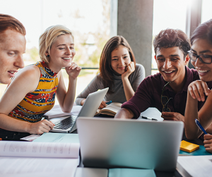 A group of students at a laptop